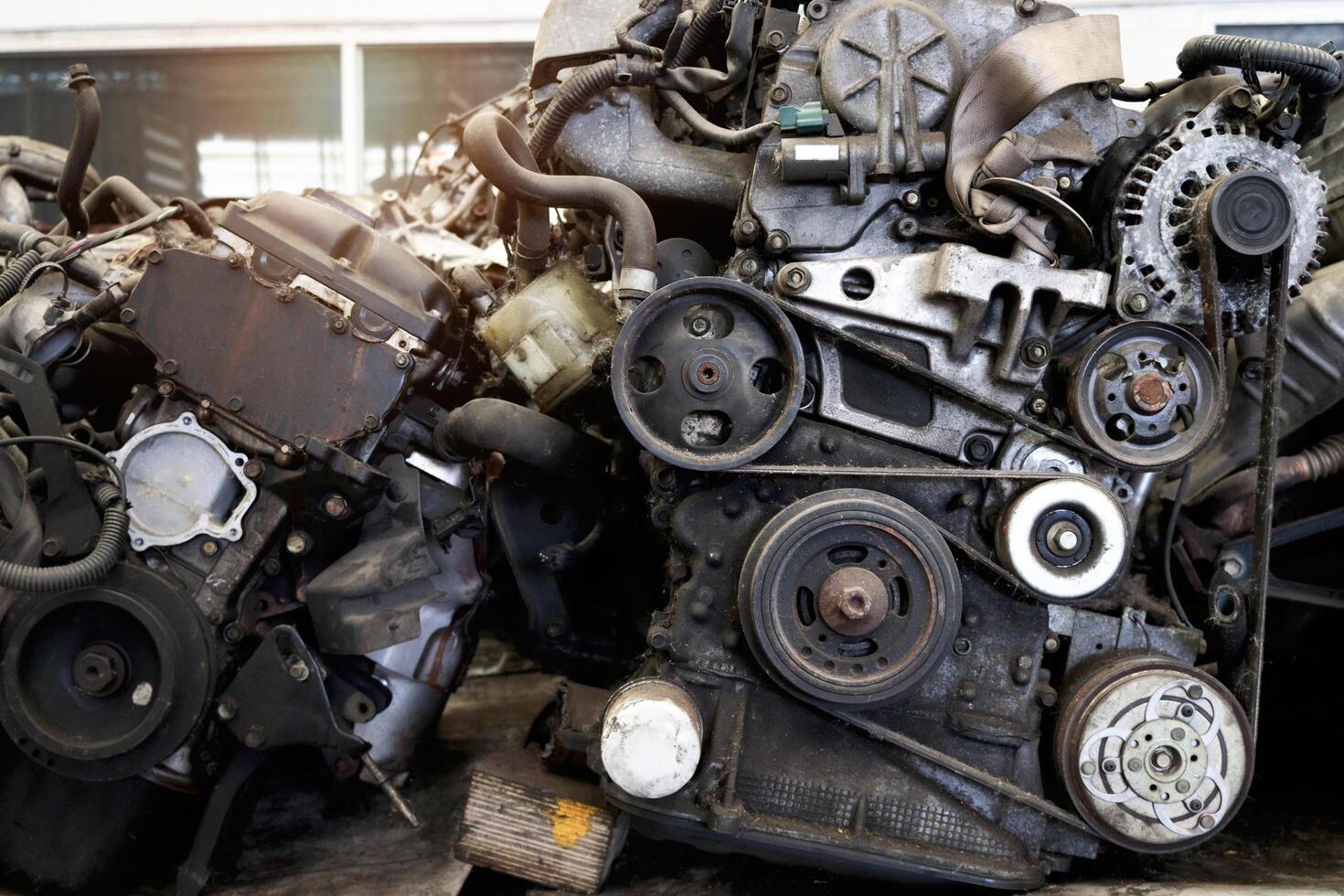 Auto parts and secondhand engine components in auto spare parts store. Spare parts of vehicle in warehouse. photo