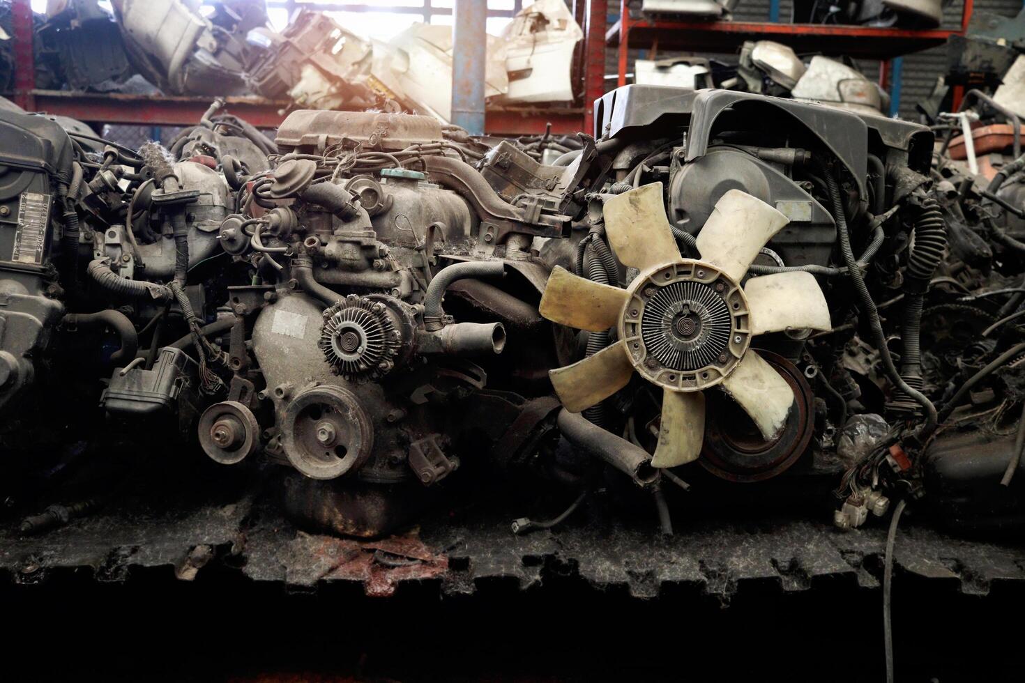 Auto parts and secondhand engine components in auto spare parts store. Spare parts of vehicle in warehouse. photo