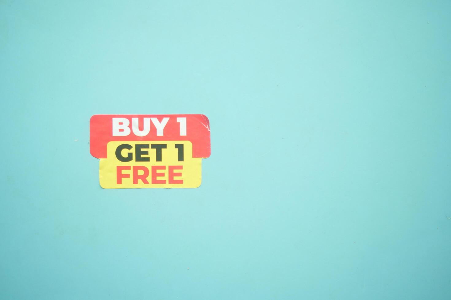 buy 1 get 1 free offer sticker and prodcuts on table photo