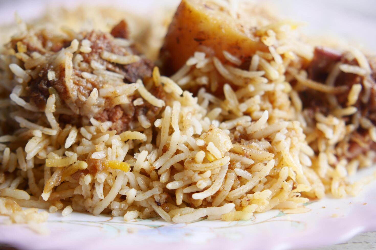 mutton biryani meal in a plate on table. photo