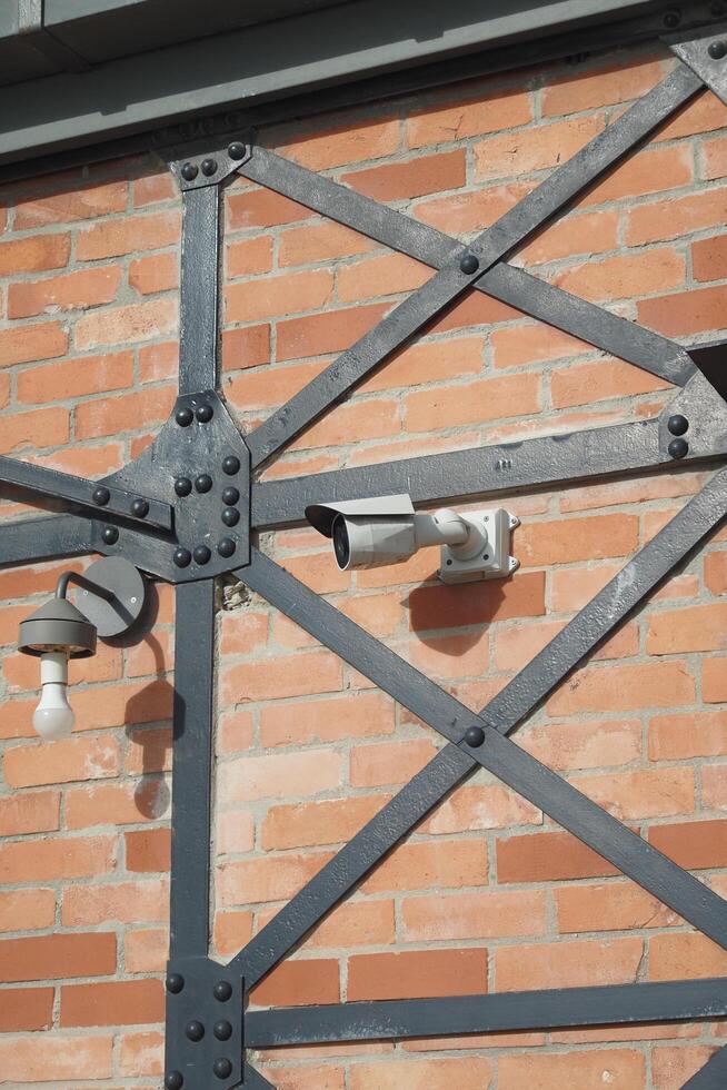 CCTV security camera operating outdoor photo