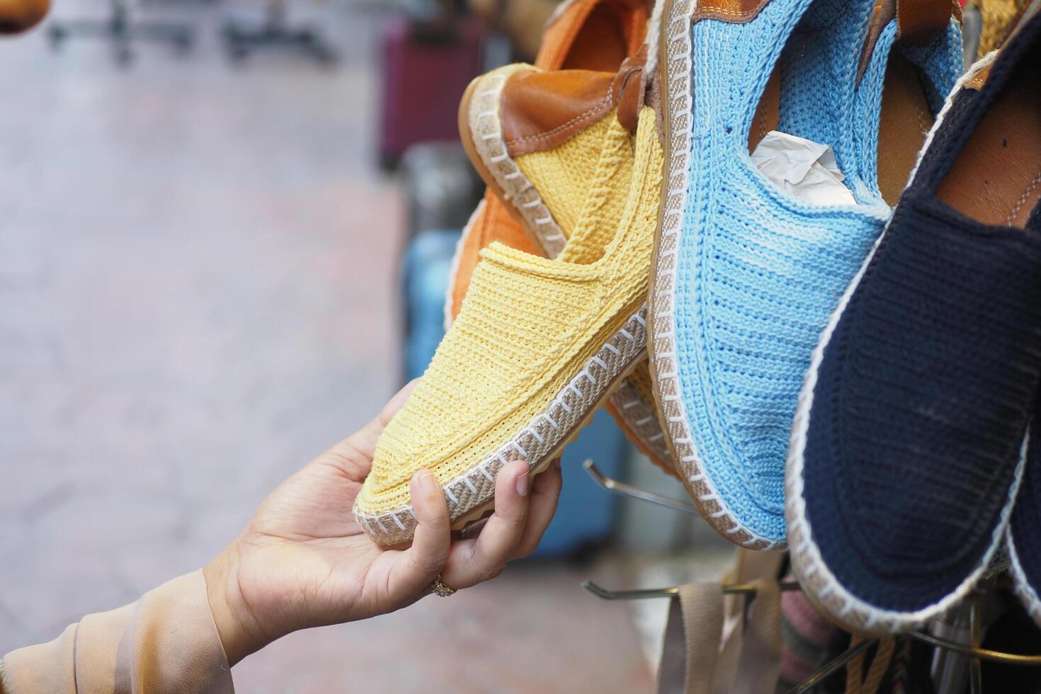 women choosing shoes at local store photo