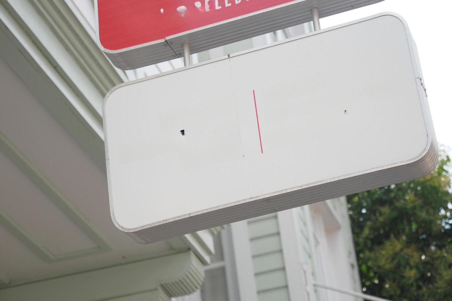 Street signboard mockup on modern city building photo