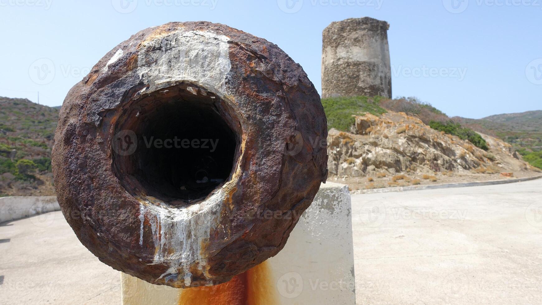 The mouth of an ancient cannon on one of the seaside lookouts of Asinara in Sardinia, Italy. photo