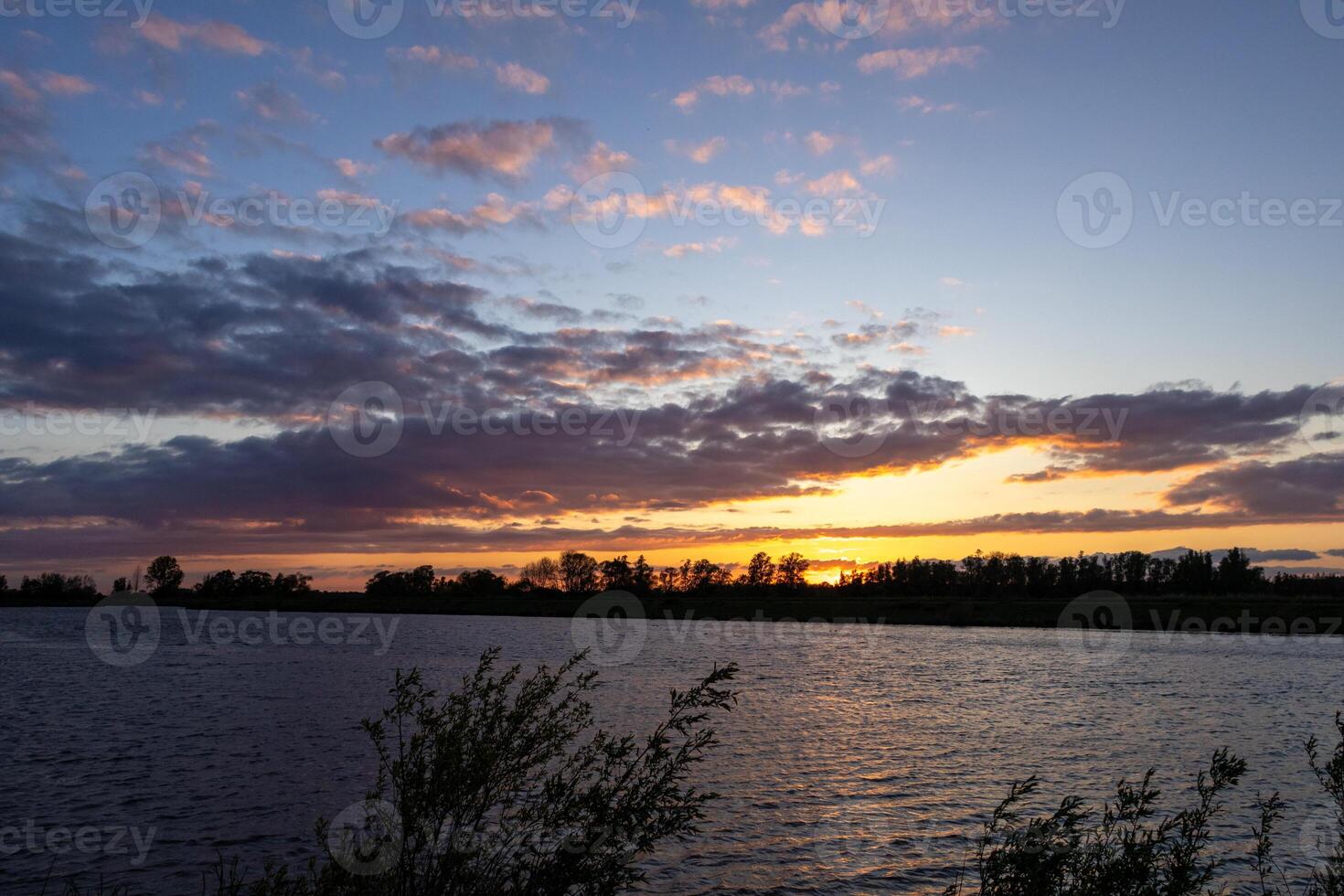 beautiful red evening sky at biesbosch national park photo