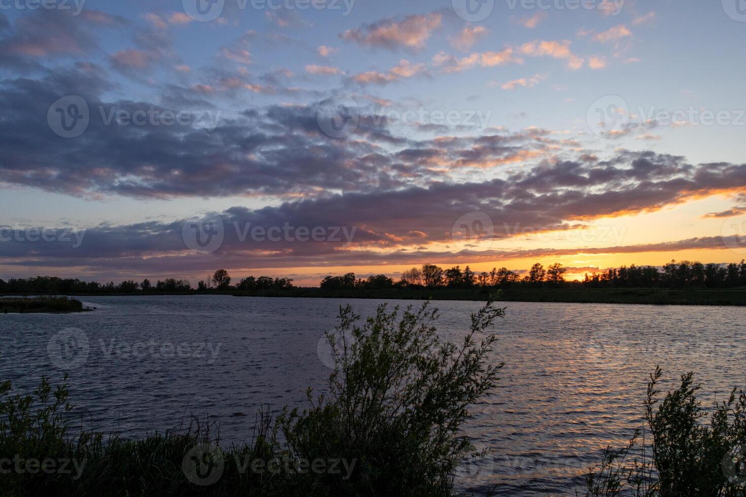 beautiful red evening sky at biesbosch national park photo