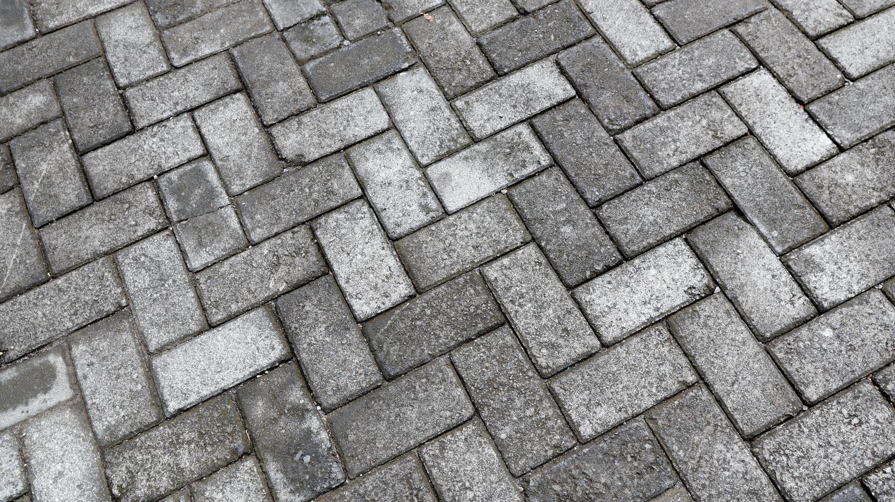 Outdoor gray paving blocks stone texture photo