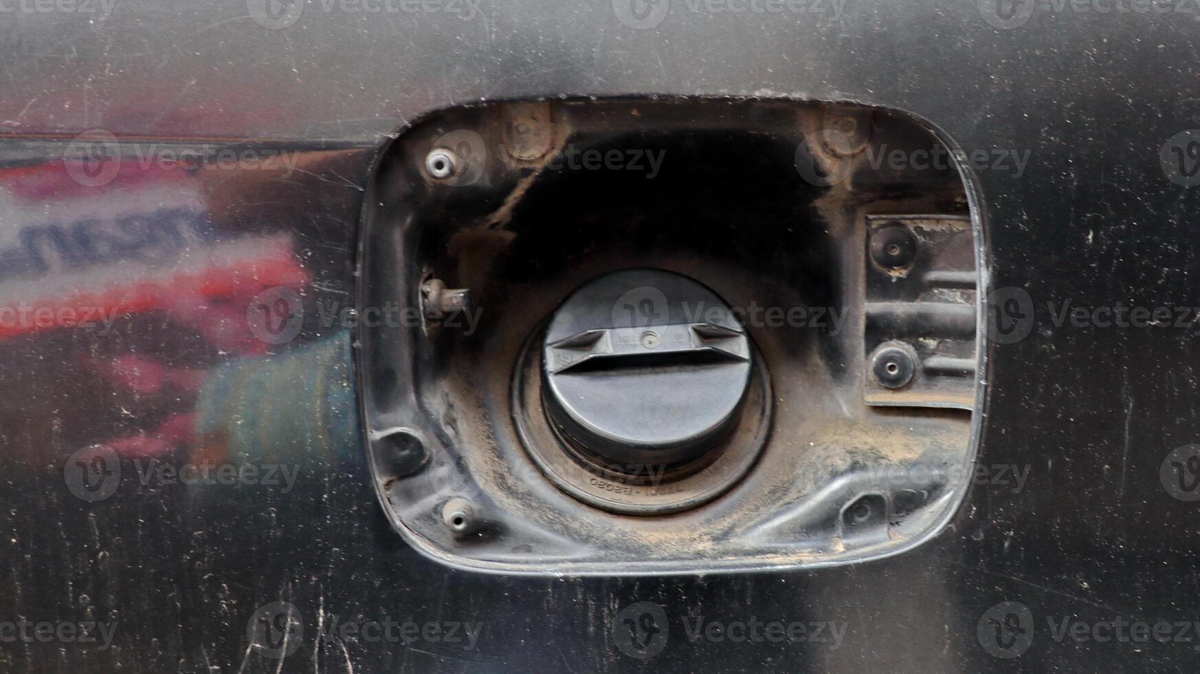 Missing fuel tank cover for damaged car petrol photo