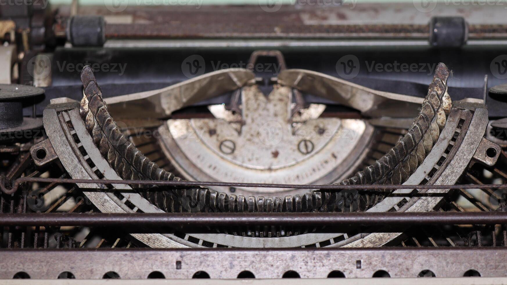 Closeup shot of types and mechanism of retro typewriter photo