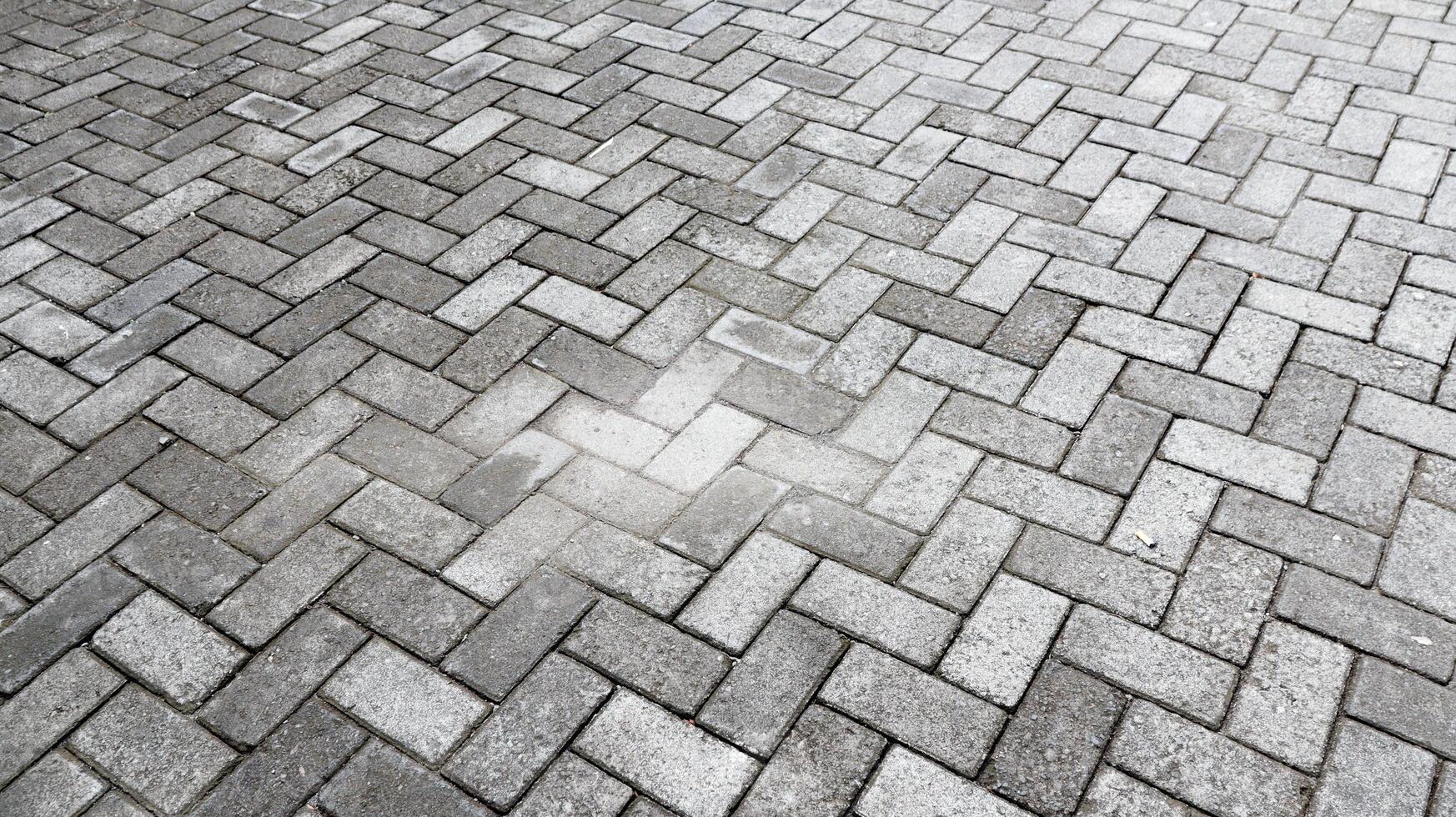 Outdoor gray paving blocks stone texture photo