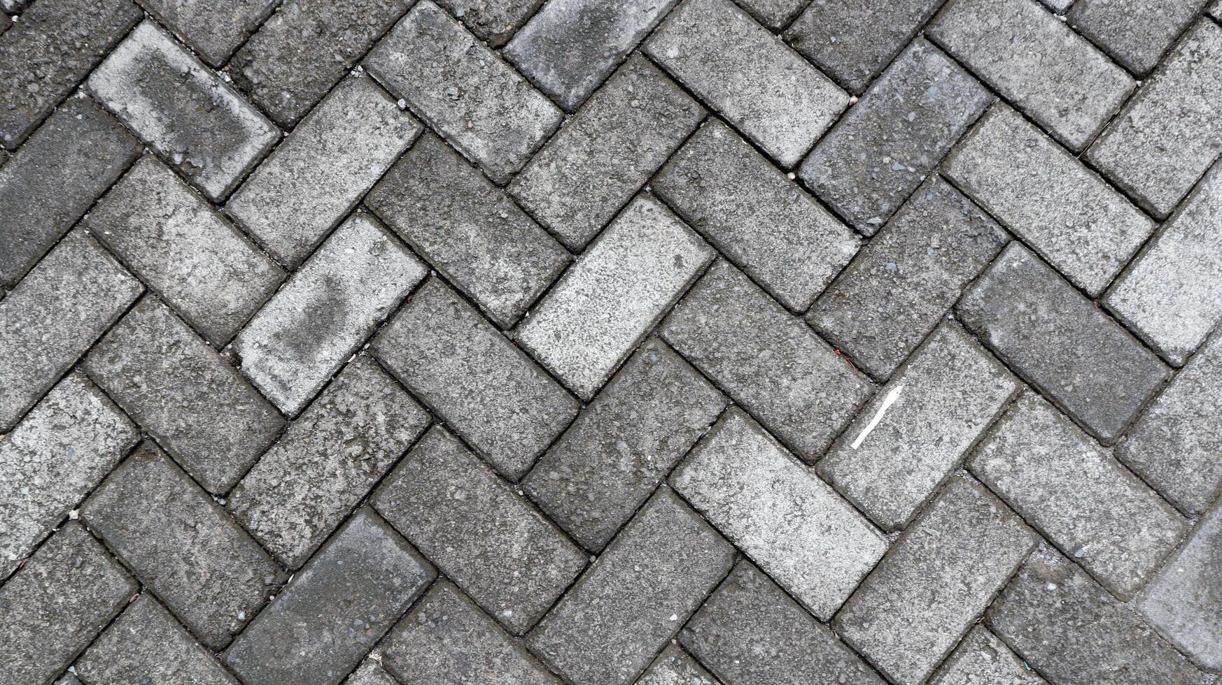 Outdoor gray paving blocks stone texture photo