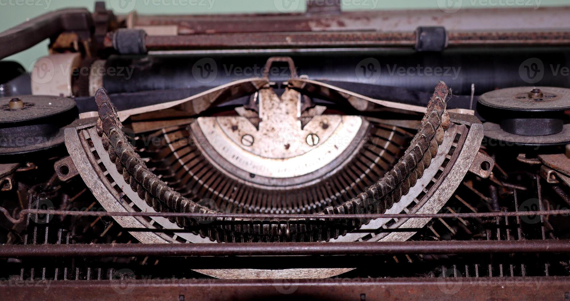 Closeup shot of types and mechanism of retro typewriter photo