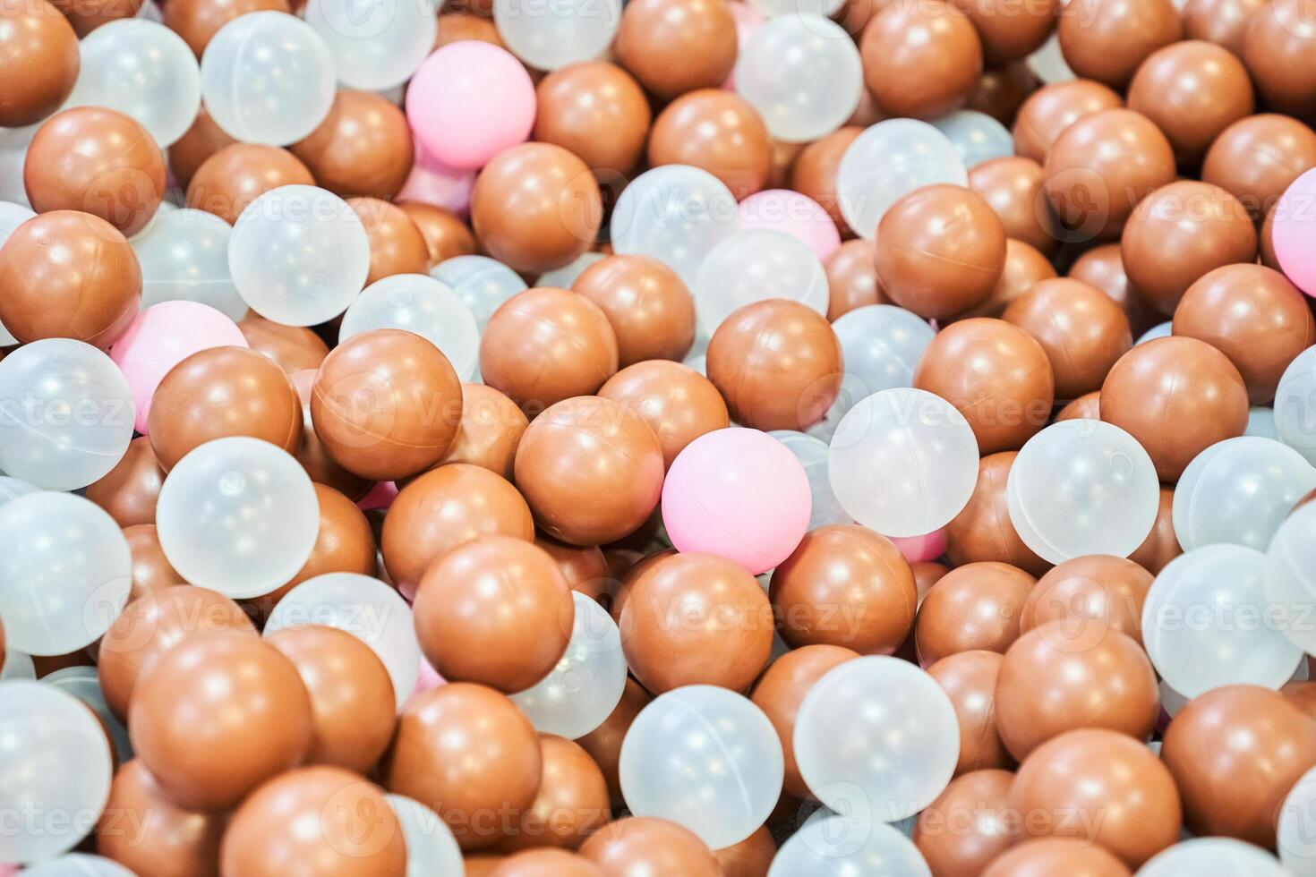 Close-up of colored plastic balls in the pool of the playroom. With space to copy photo