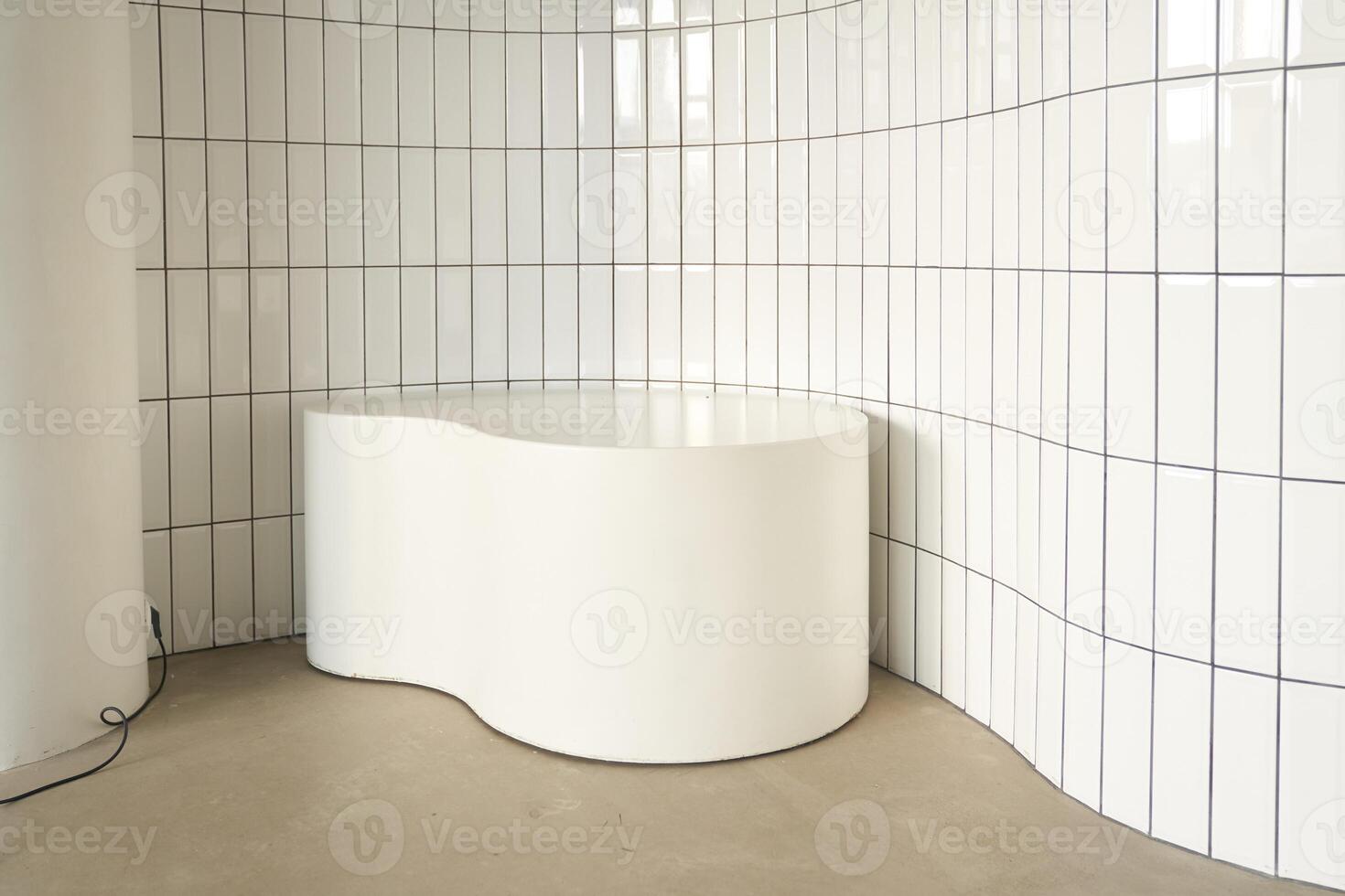 The stone podium is white. The background of modern design is an empty stand, an advertising stage or an empty presentation pedestal. The concept or layout of a stone showcase. photo