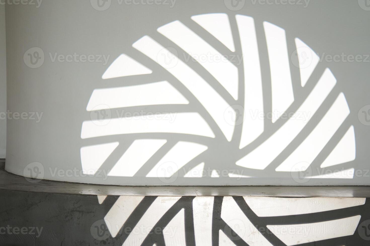The silhouette of the gobo mask on the wall surface with space to copy. A step ledge with a shadow from a light stroke photo