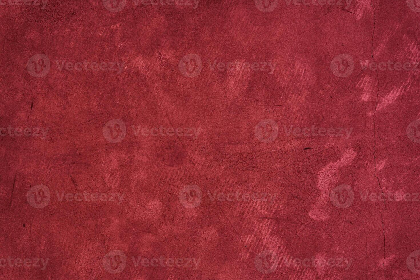 The surface of old concrete with stains. The color of 2023, viva magenta red with space to copy photo