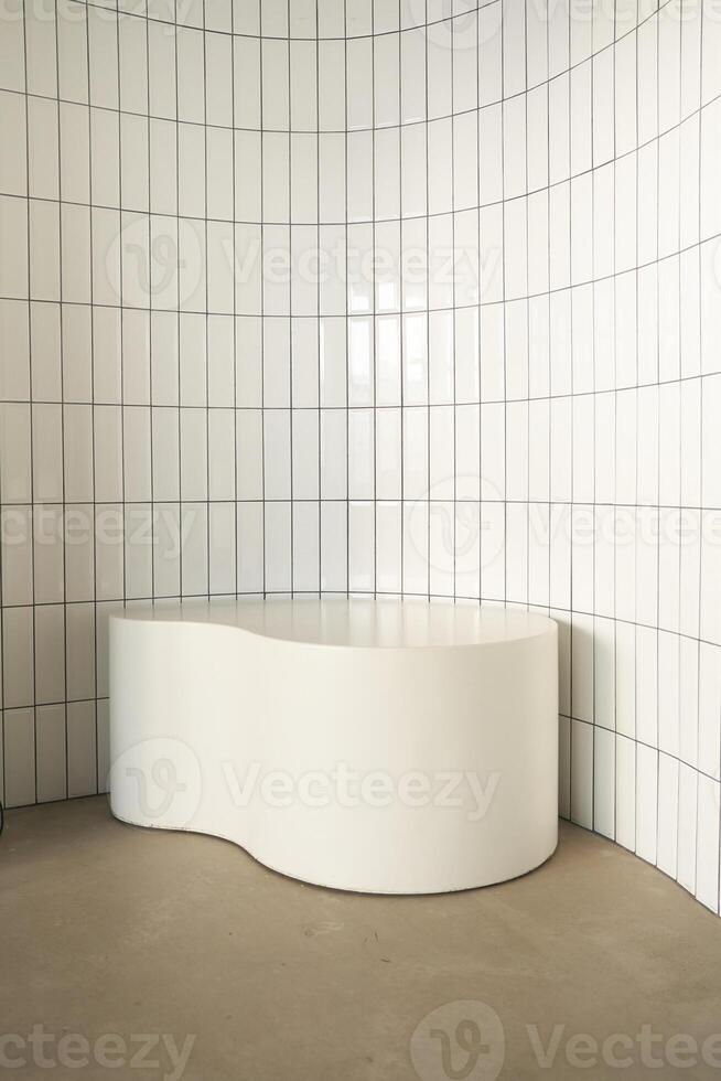 Close-up of the podium in white. With space to copy. An empty stand, an advertising stage, or an empty presentation pedestal. photo