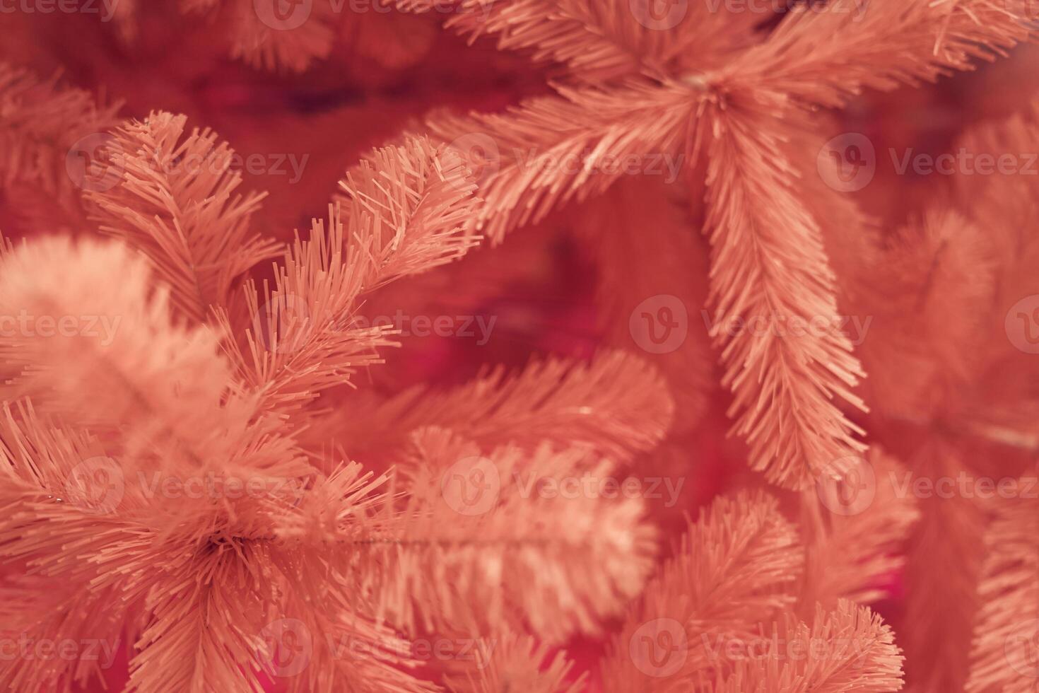 Close up top view of pink Christmas tree with copy space. Background with branches with selective focus, bokeh. Concept of greeting cards, congratulation, decor, textured background, wallpaper photo