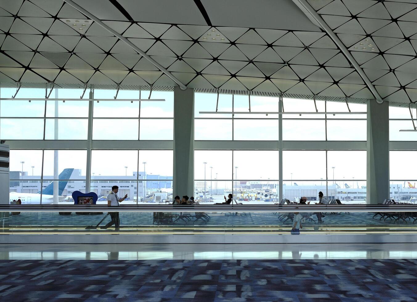 Airport terminal huge glass window with view of airplanes, the gate of departure hall for travelling photo