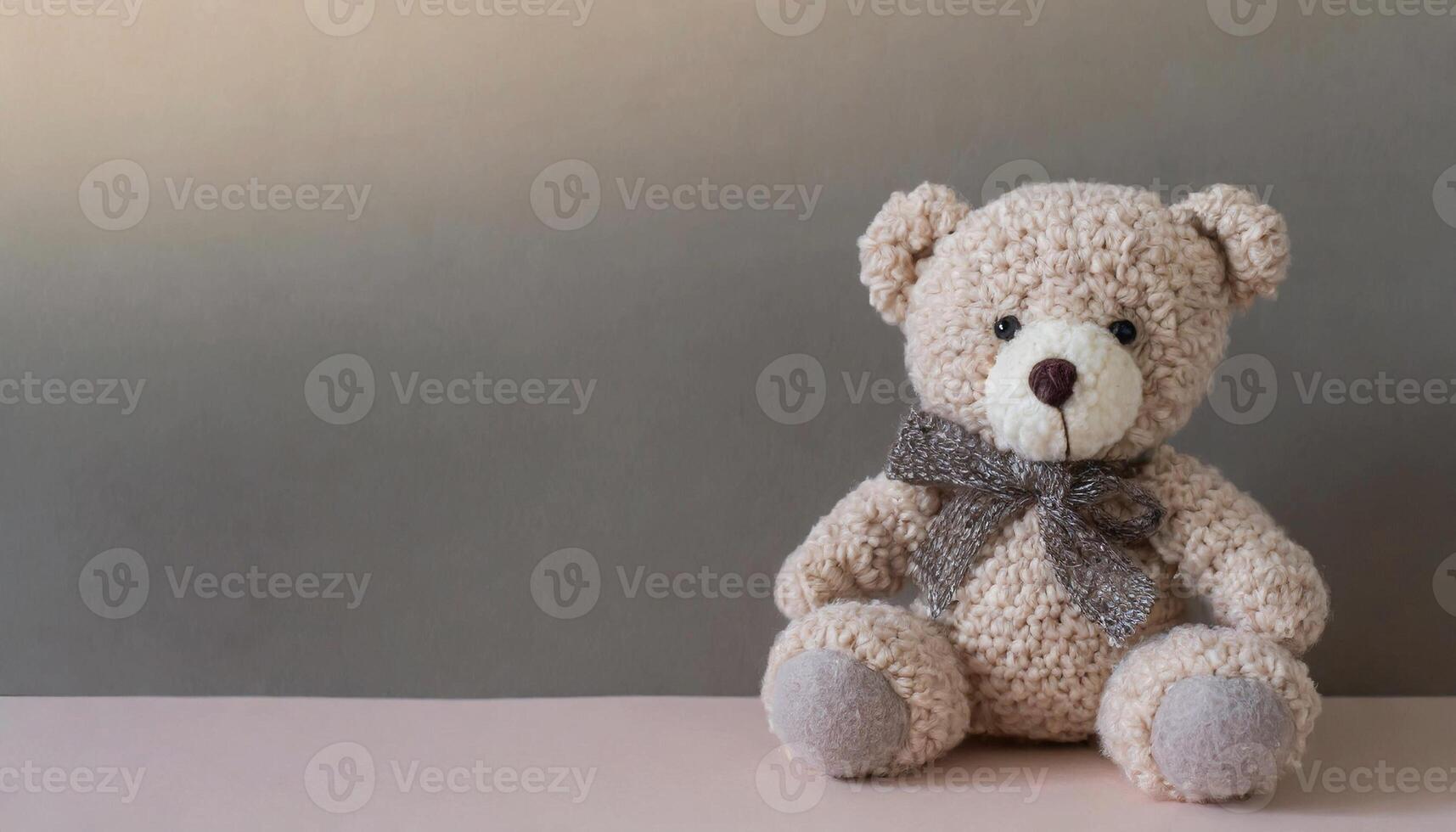 Beautiful teddy bear sitting, children's plush toy. photo