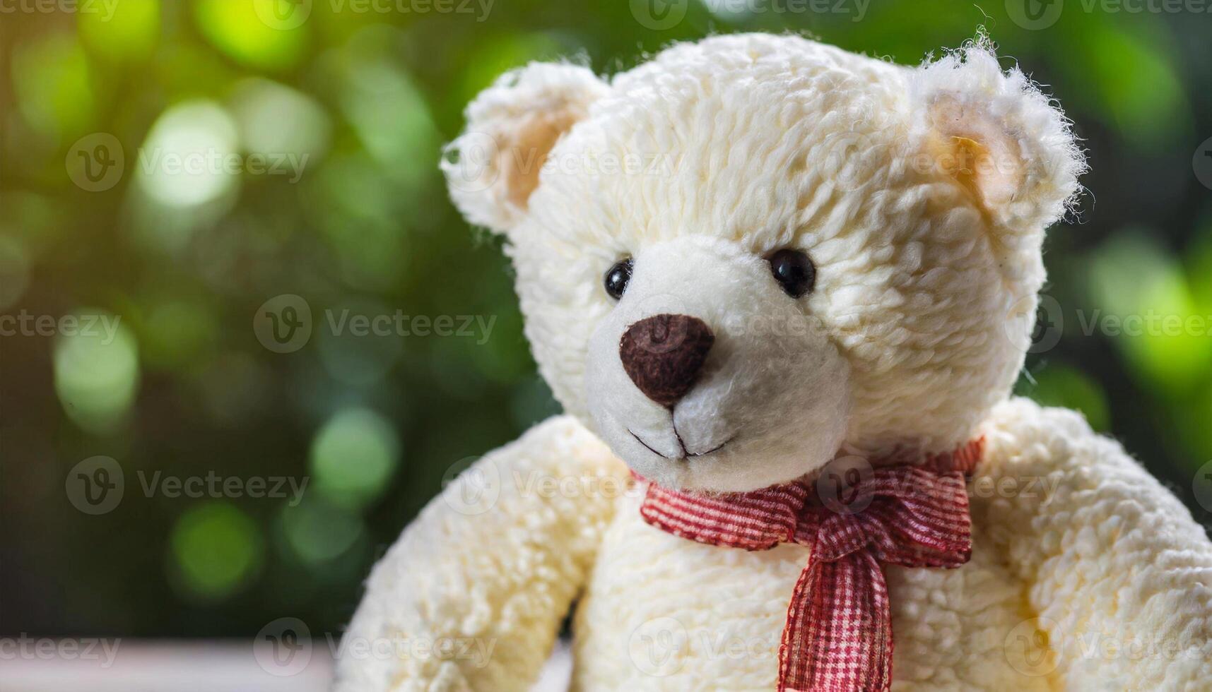 Teddy bear, children's plush toy. Natural blurred background photo