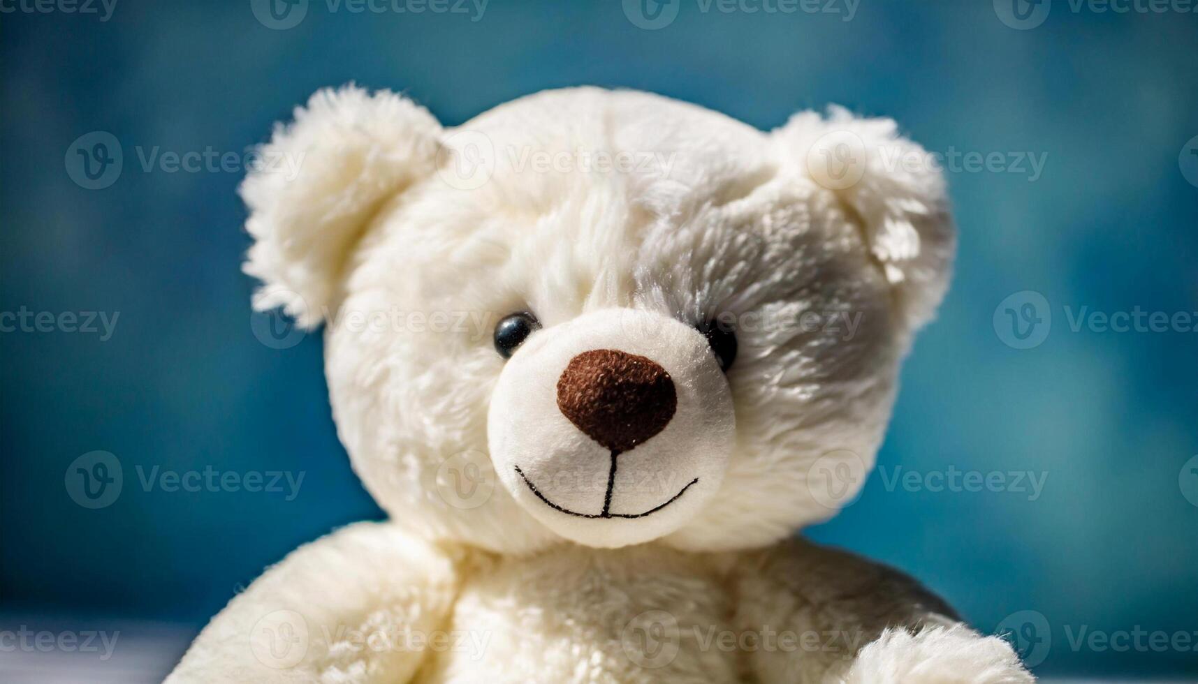 Beautiful teddy bear, children's plush toy. Blue bokeh photo