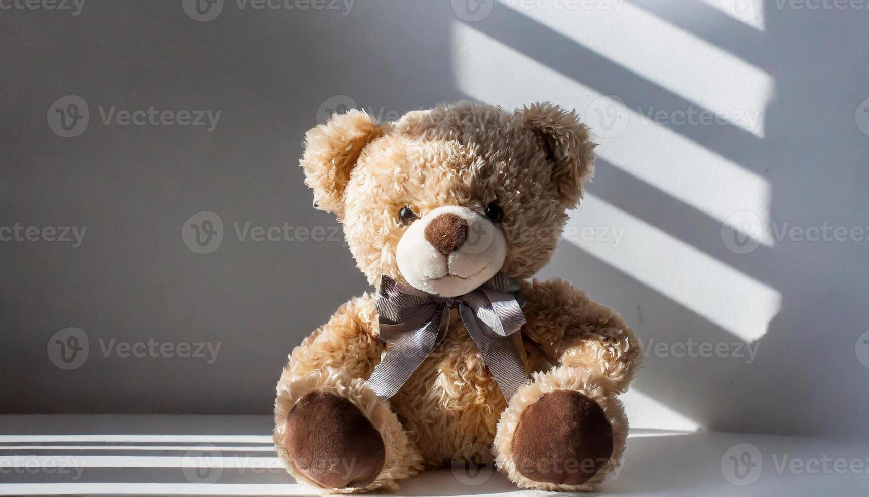 Beautiful teddy bear sitting, children's plush toy. photo
