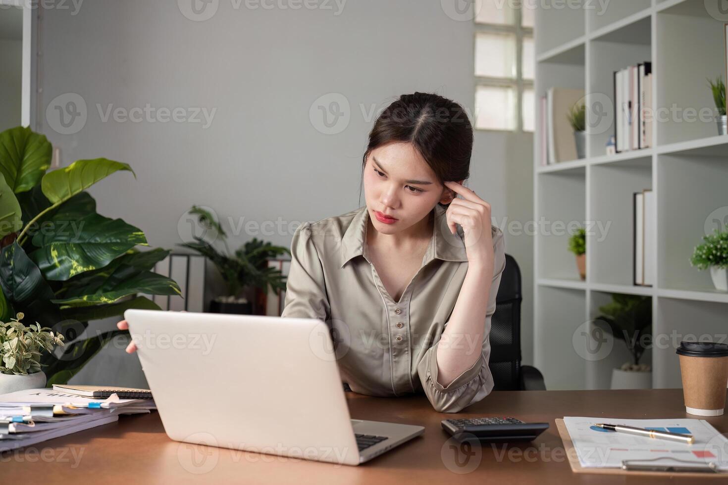 Young Accountant Stressed Over Work Problem in Modern Office with Laptop and Documents, Experiencing Workload Pressure and Anxiety photo