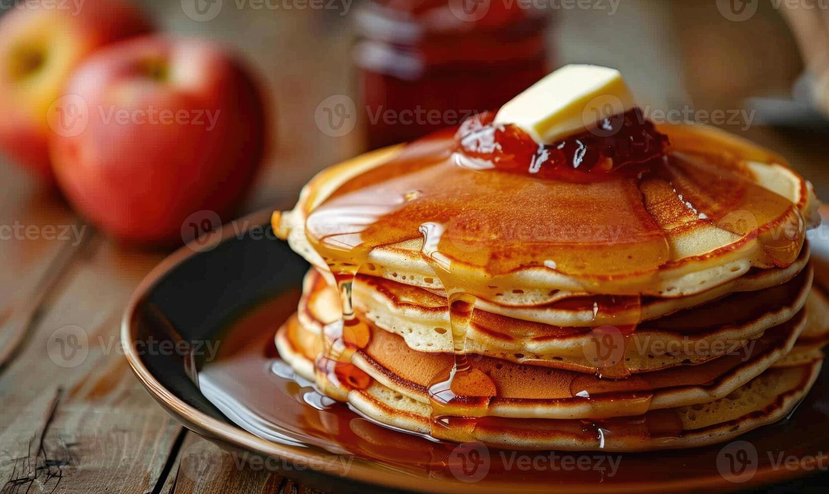 Apple jam on a stack of pancakes with butter melting on top photo