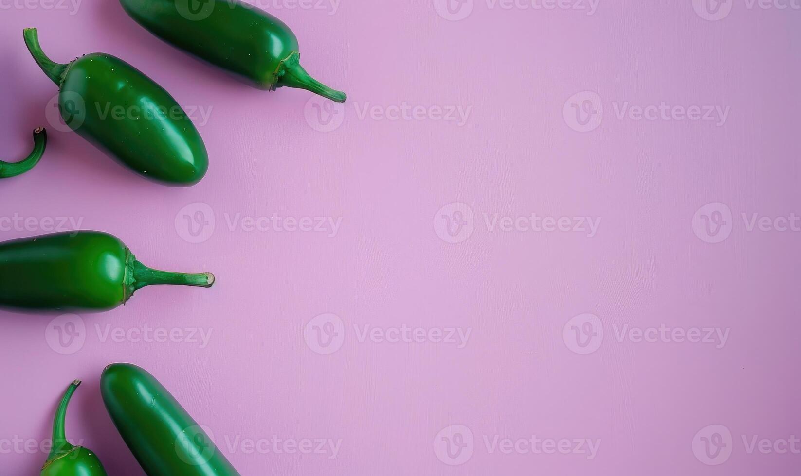 Top view of a jalapeno peppers arranged on a pastel purple background photo