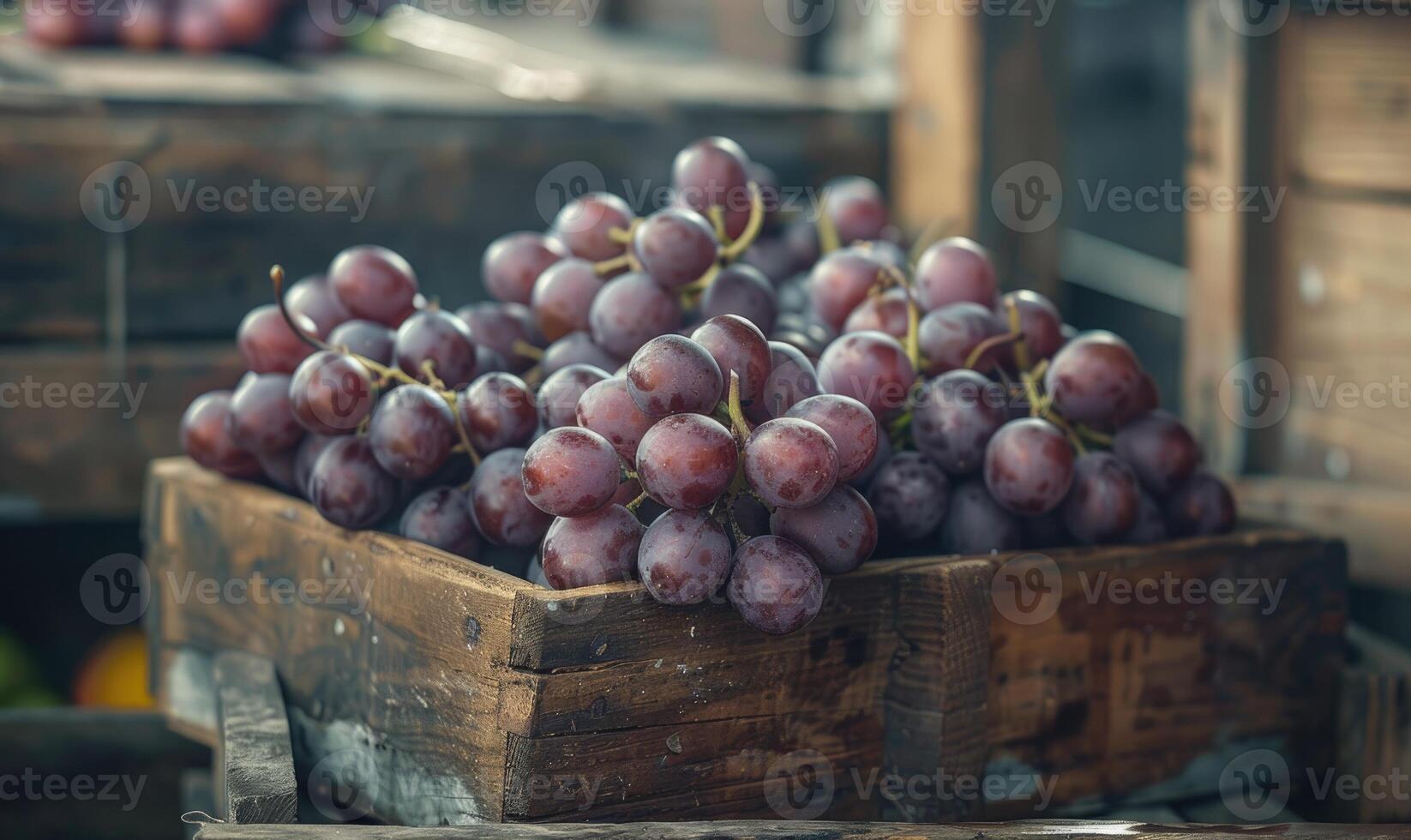 Grapes in a rustic box on a countryside market table photo