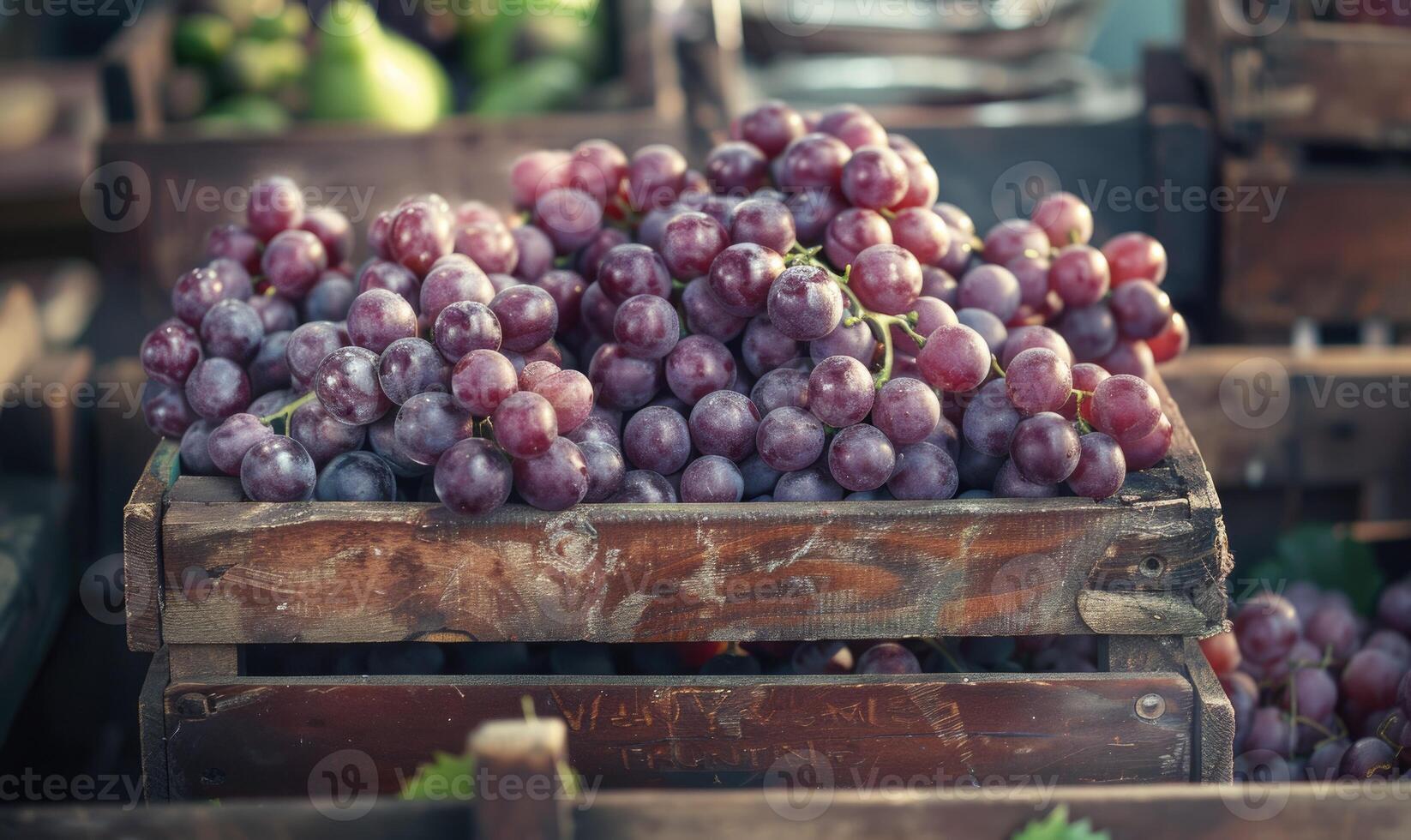 Grapes in a rustic box on a countryside market table photo