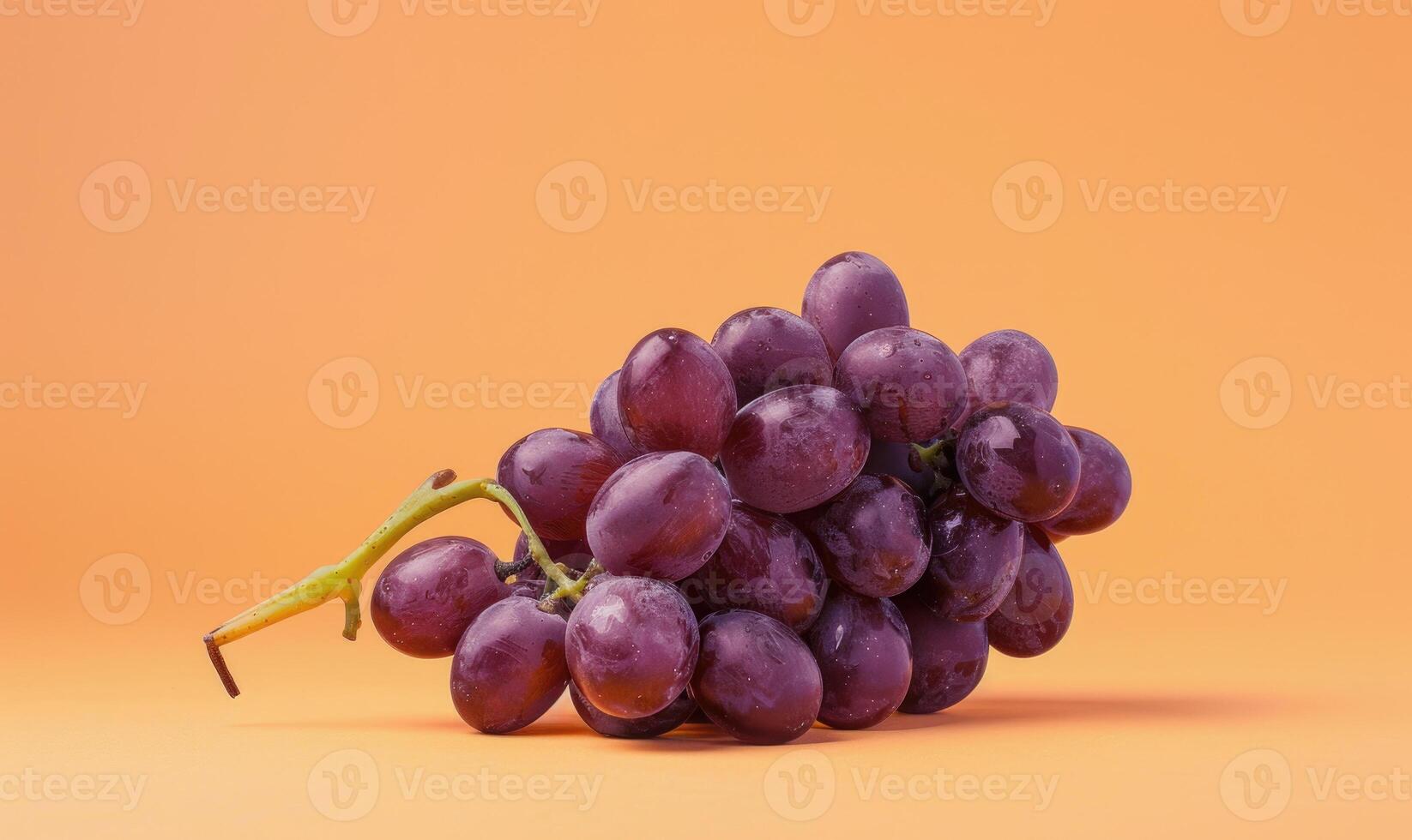 Grapes on a light pastel orange background photo