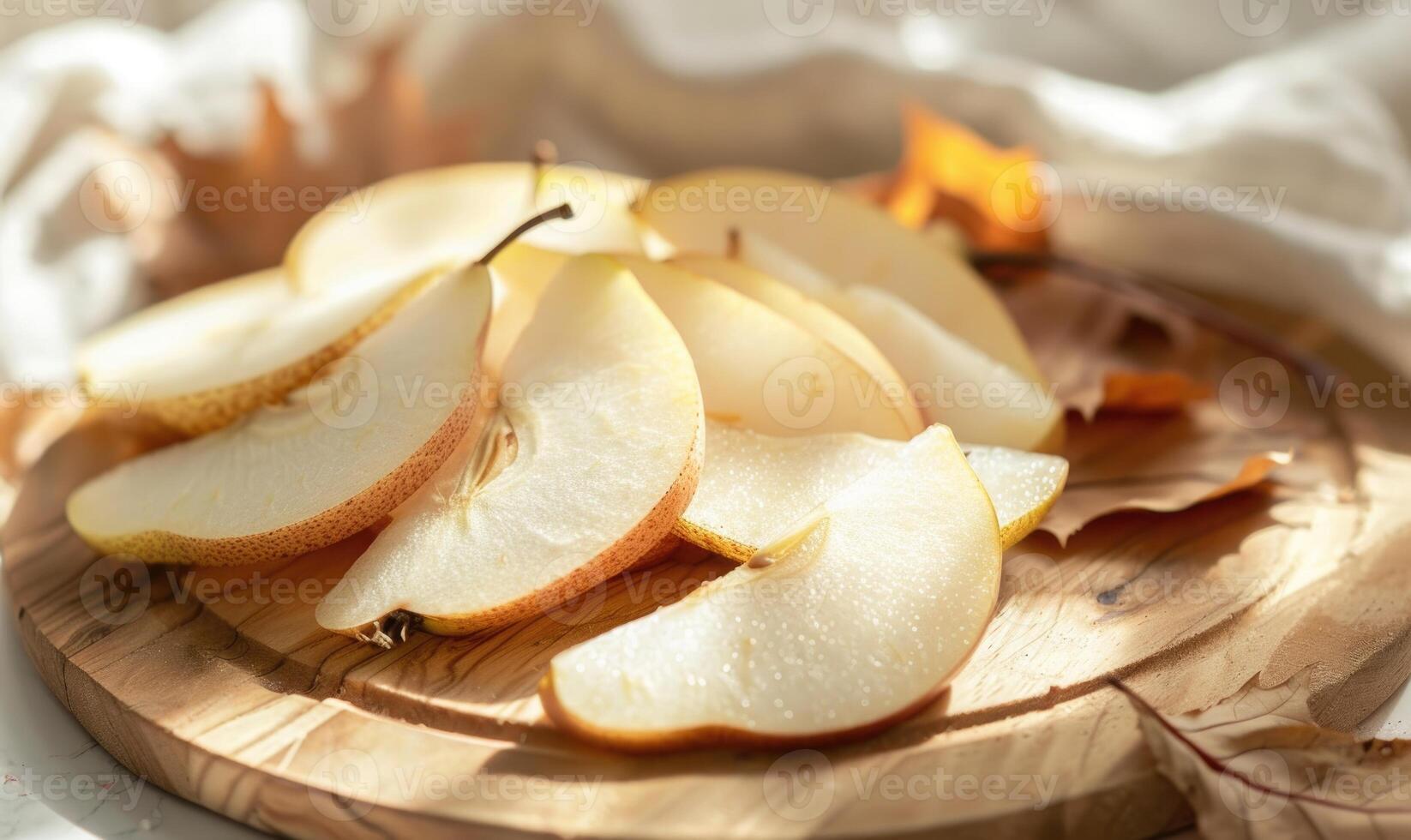Close-up view of fresh pear slices on a wooden board photo
