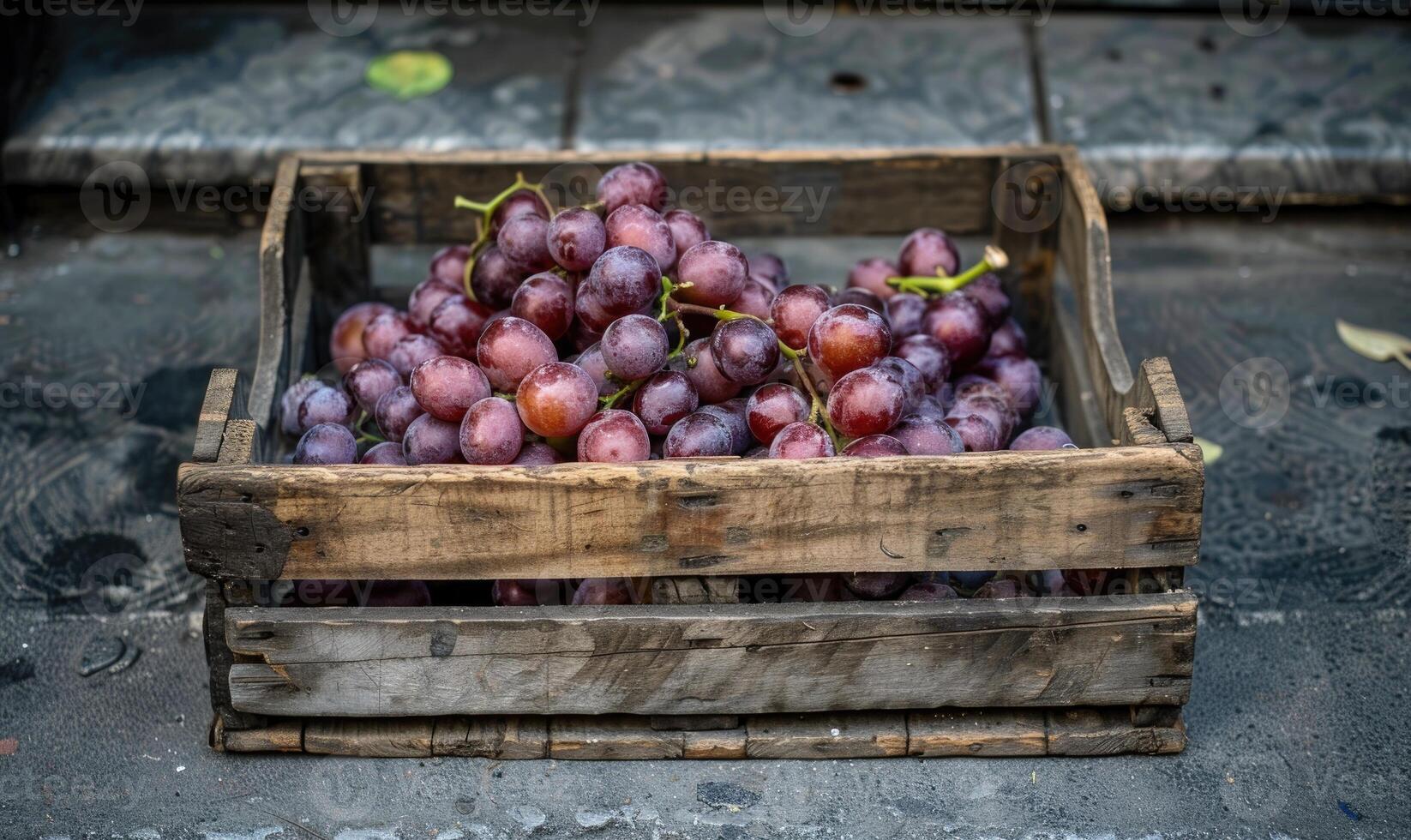 Grapes in a vintage wooden crate on a sidewalk stand photo