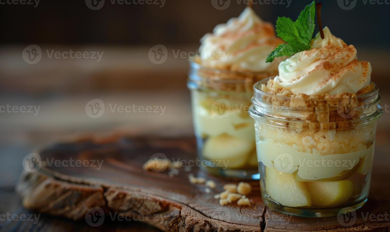 Pear and mascarpone layered dessert in a jar, topped with a sprig of mint photo