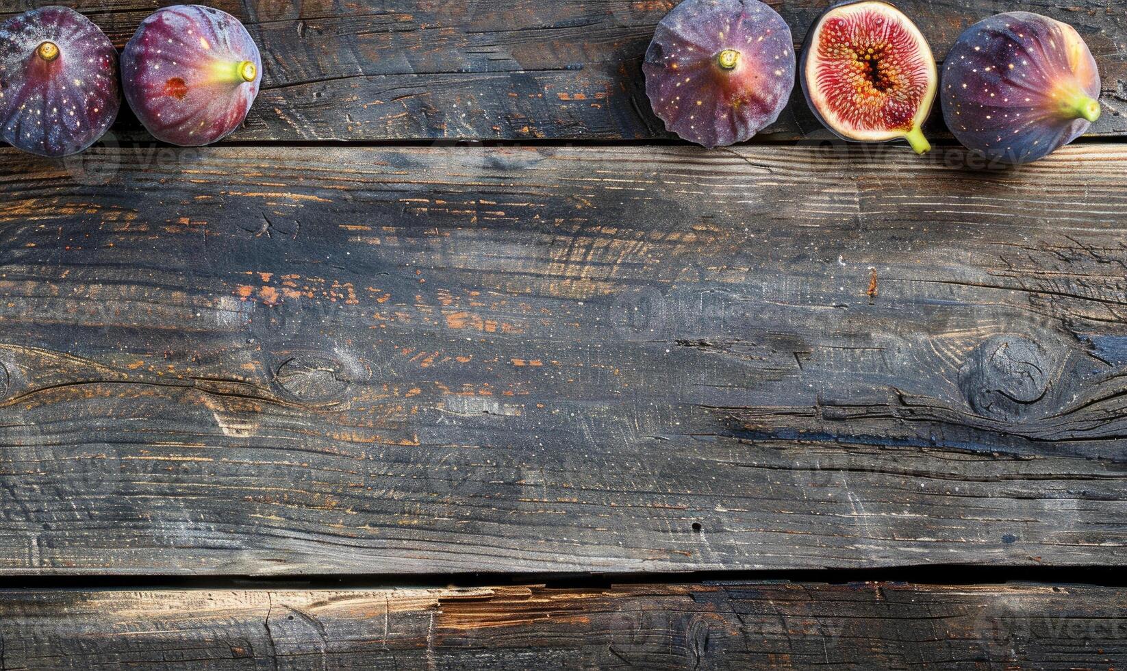 Fresh figs on a rustic wooden surface photo
