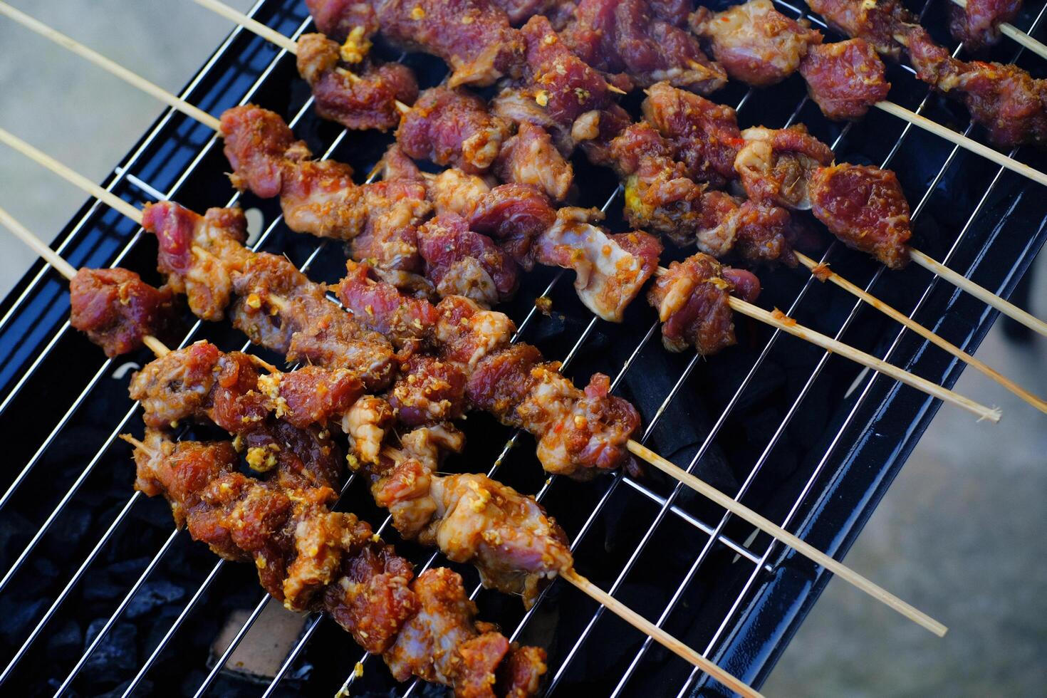 Lamb Satay grilled with Indonesian Maranggi Seasoning. Lamb meat is skewered with bamboo sticks and then grilled over charcoal. Delicious Foods. Indonesian Gourmet. Traditional Cuisine. Food photo