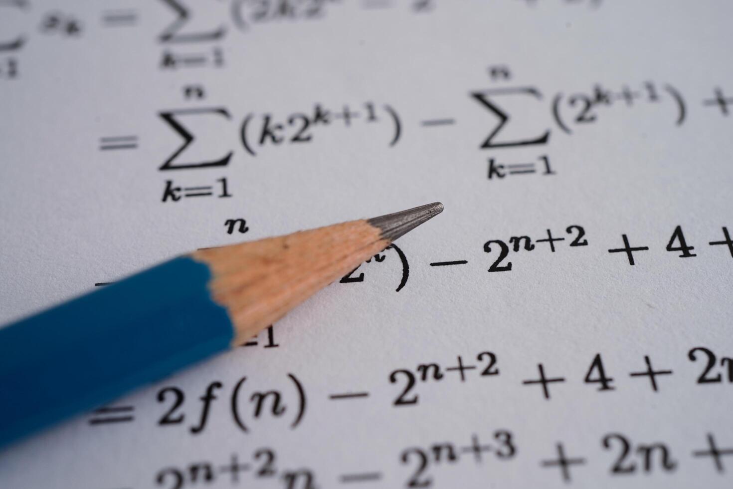 Pencil on mathematic formula exercise test paper in education school. photo