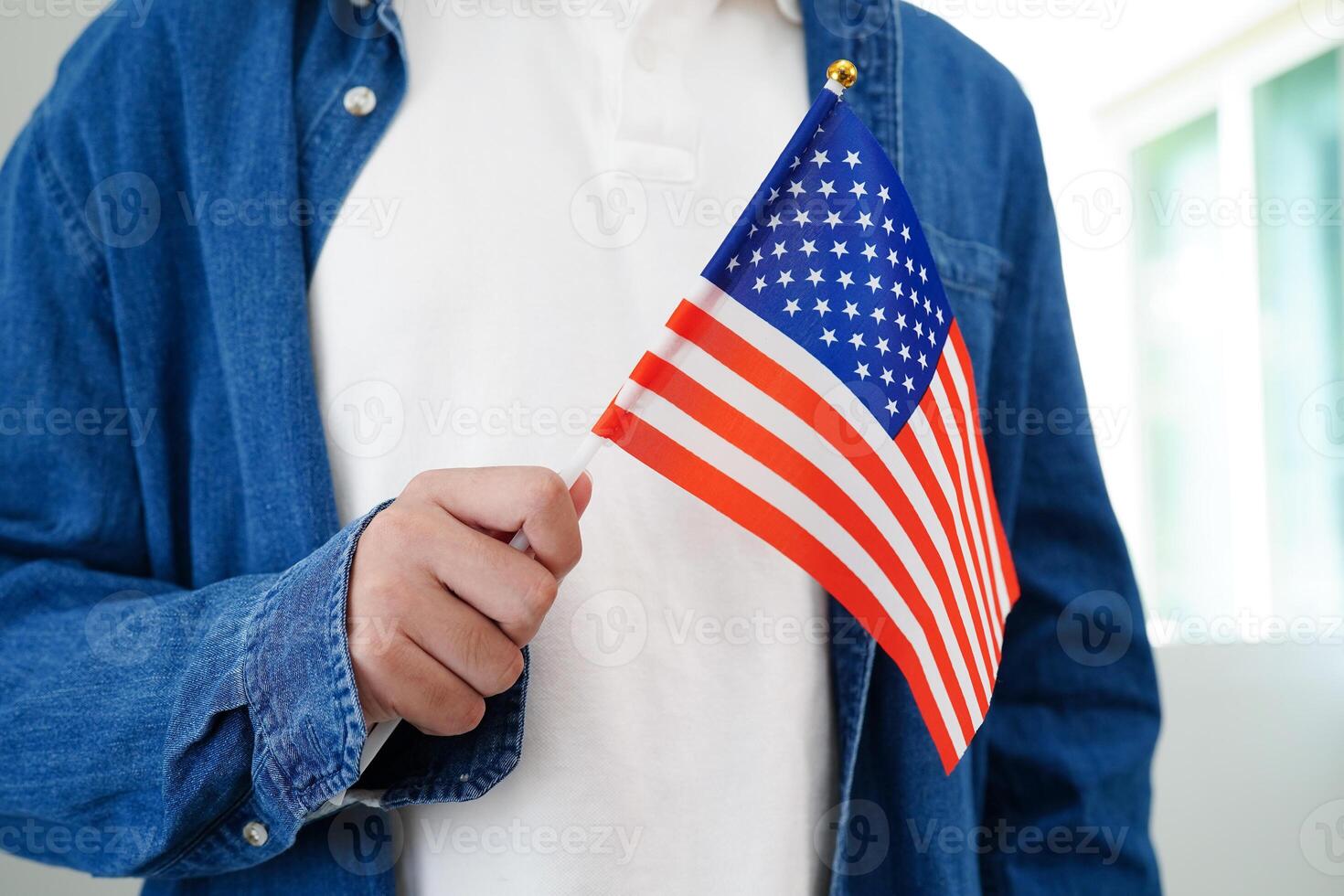 Learning English, Asian teenage student holding flag for language program education. photo