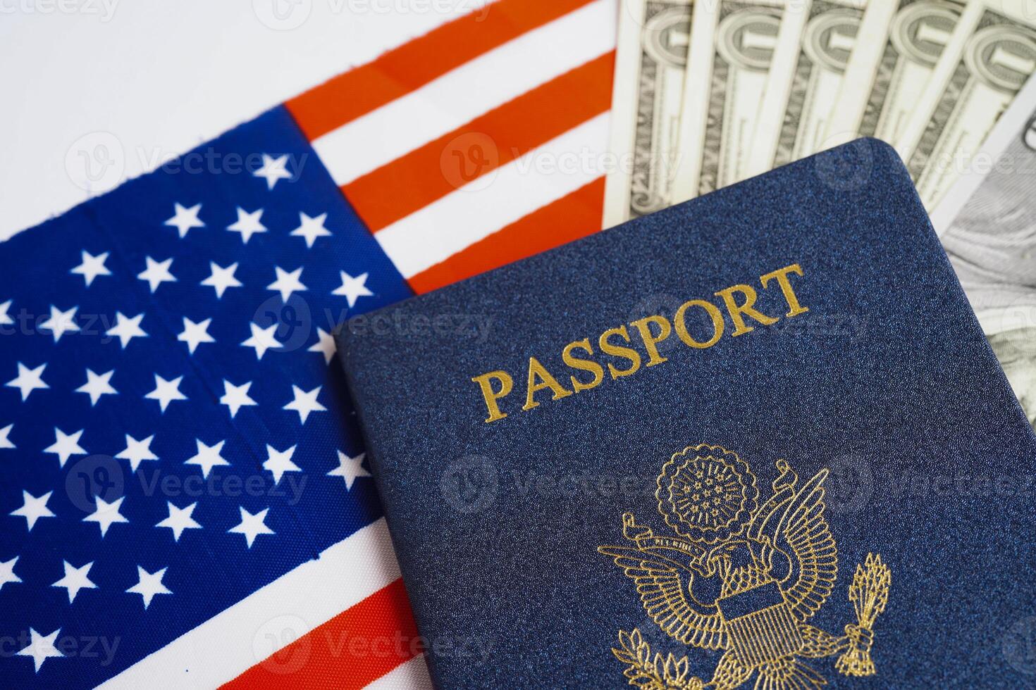 US passport with dollar money on USA flag, American citizen in United States of America. photo