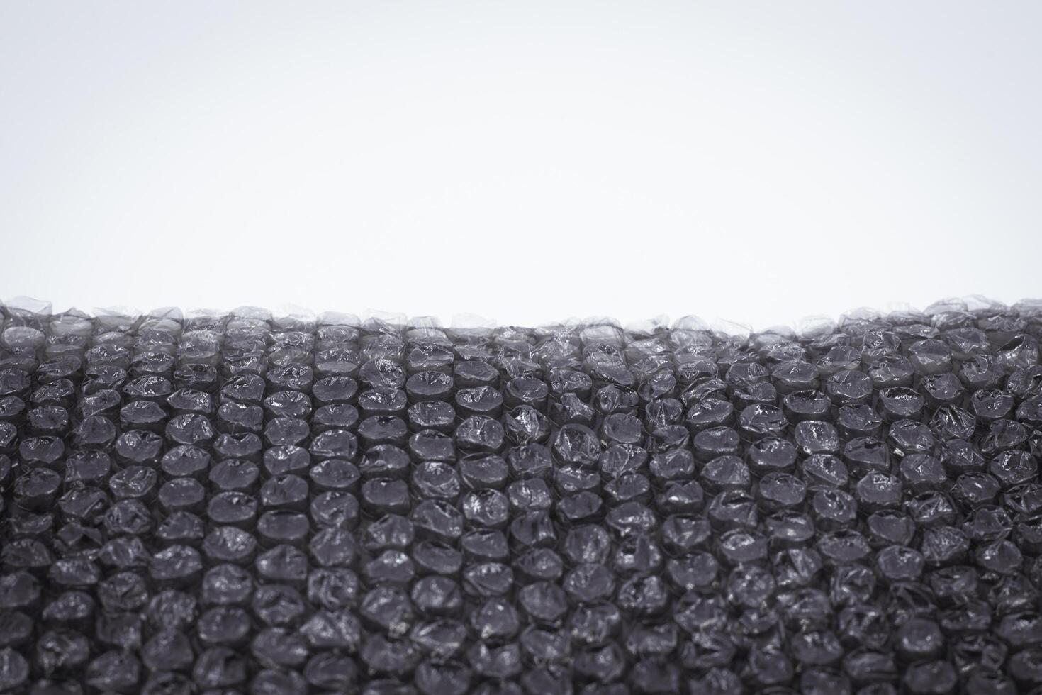 black bubble plastic wrap surface, Air Bubble wrap texture background. Plastic packaging material. photo