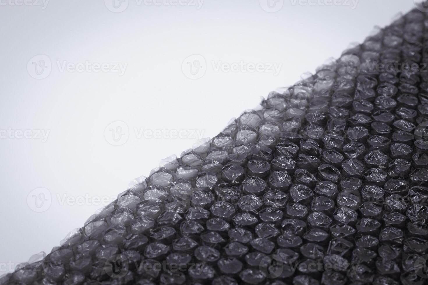 black bubble plastic wrap surface, Air Bubble wrap texture background. Plastic packaging material. photo