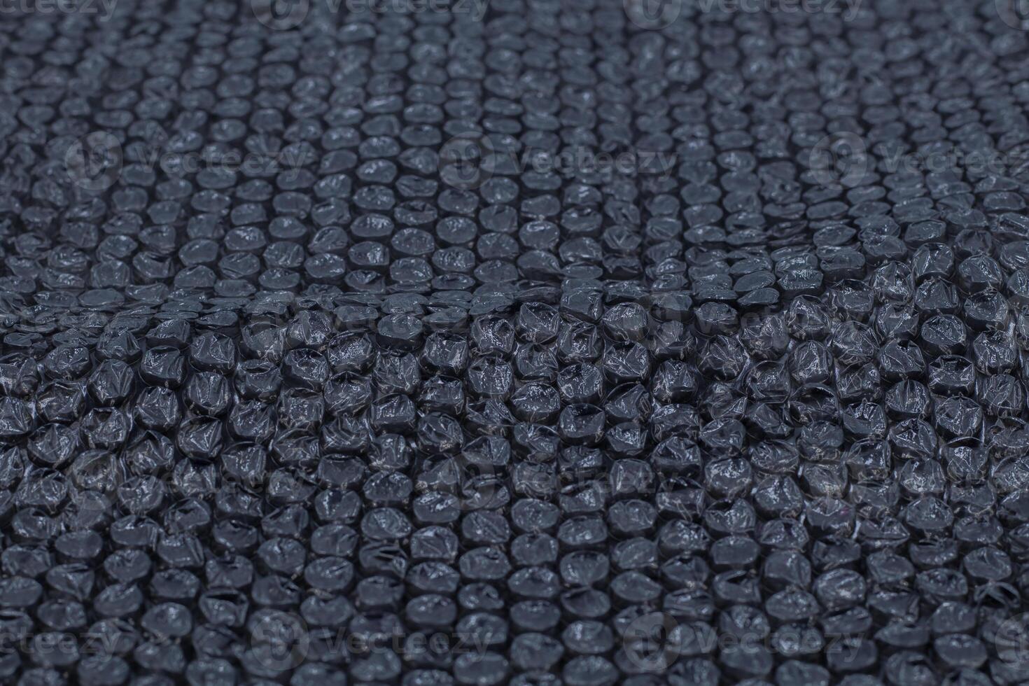 black bubble plastic wrap surface, Air Bubble wrap texture background. Plastic packaging material. photo