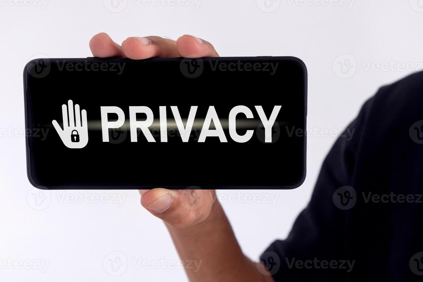 Privacy concept of private data. Man holding a smartphone with privacy written on screen. photo