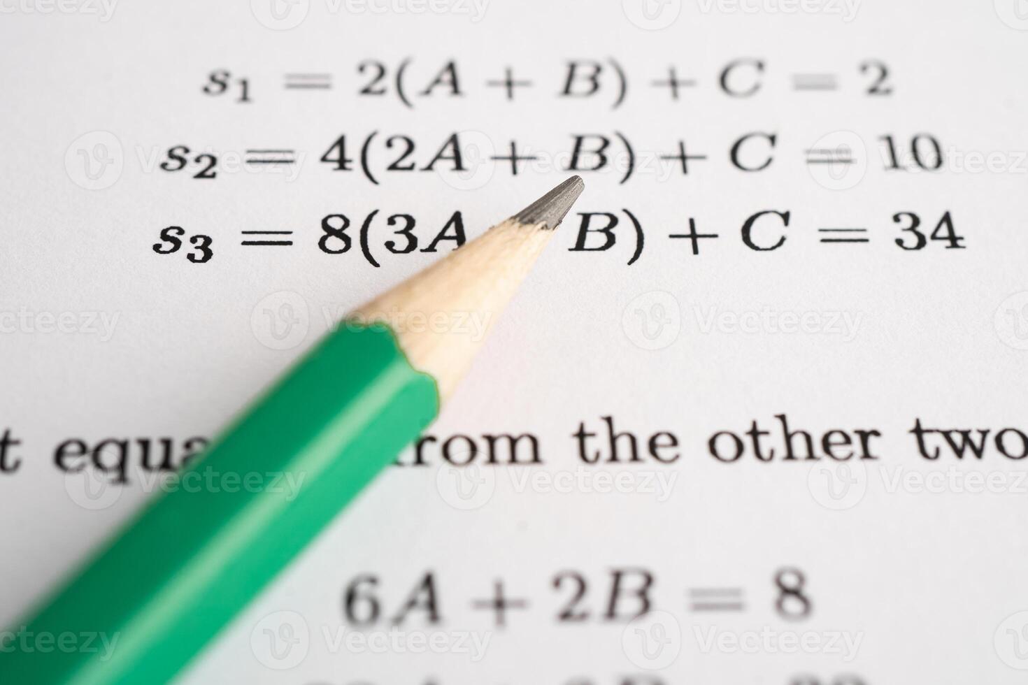 Pencil on mathematic formula exercise test paper in education school. photo