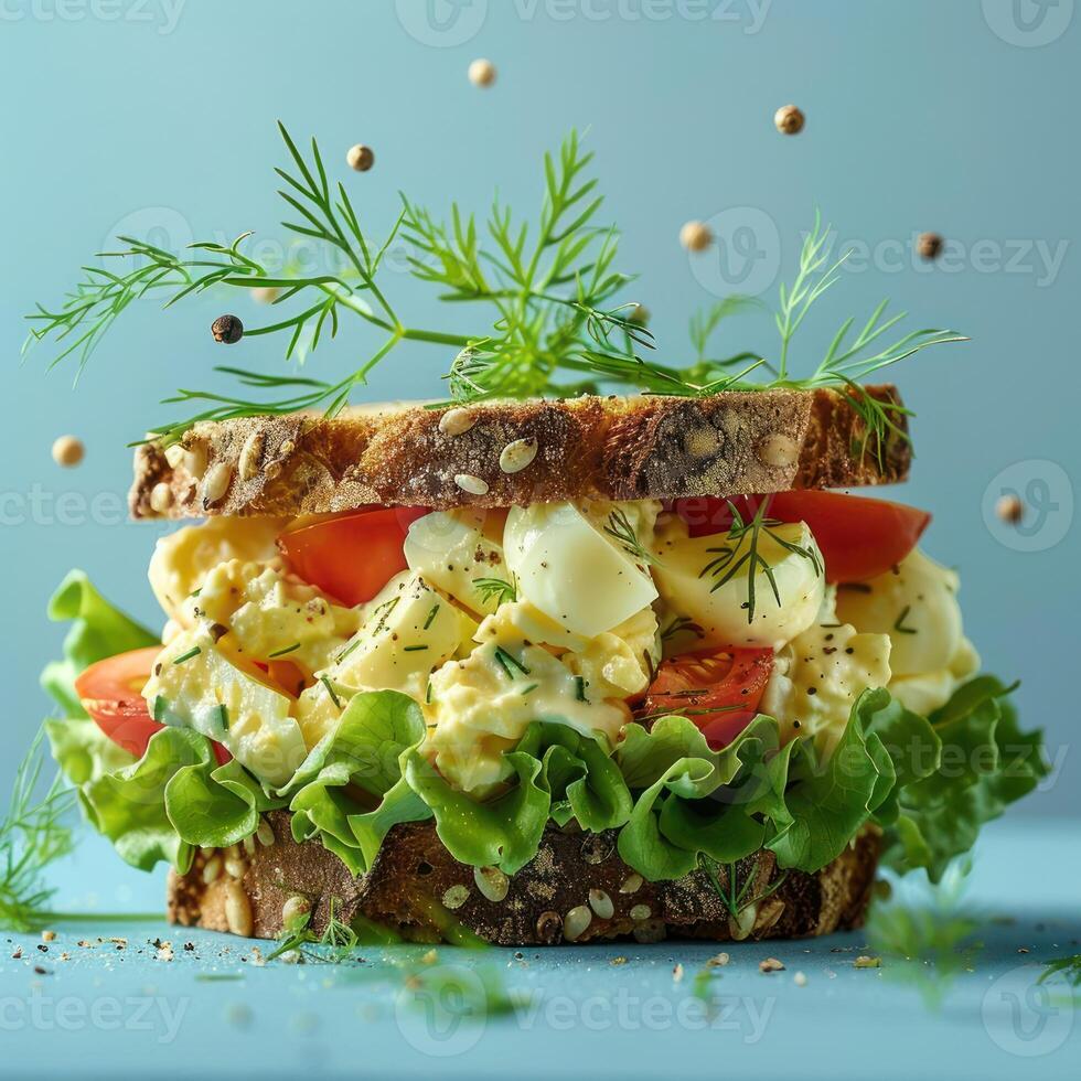 a sandwich with lettuce, tomatoes, and other toppings photo