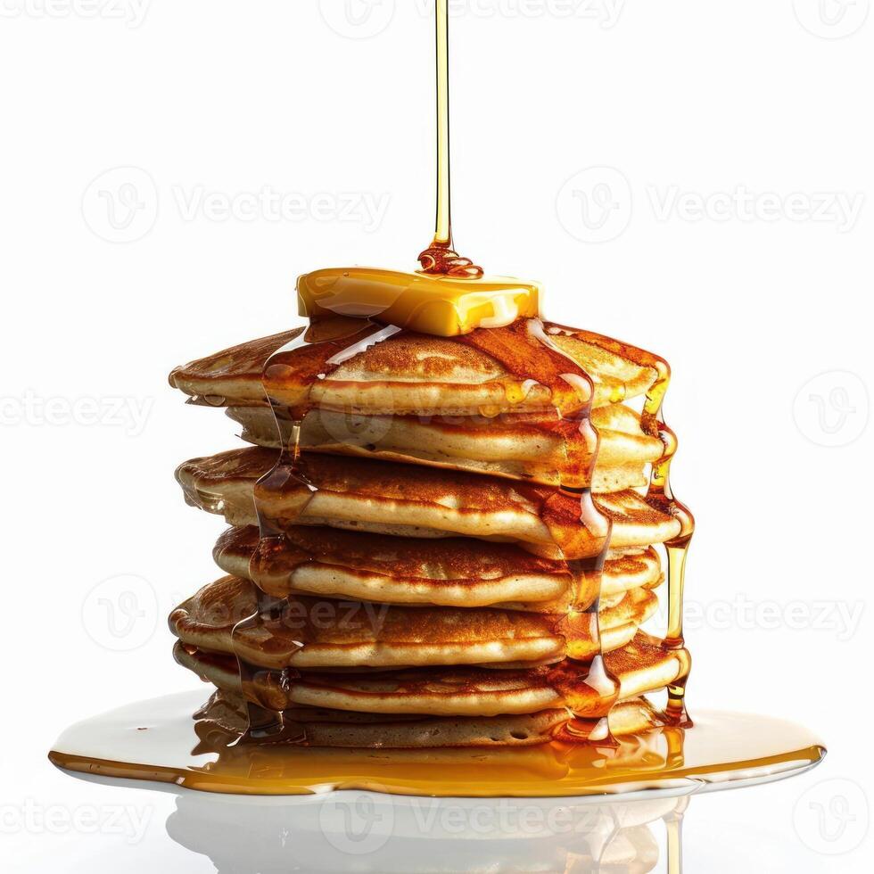 araffe with syrup pouring on top of a stack of pancakes photo