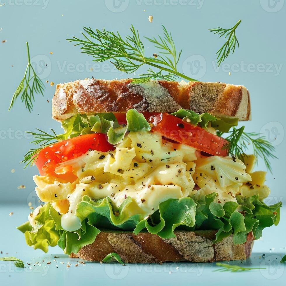 a sandwich with lettuce, tomato, and cheese on it photo
