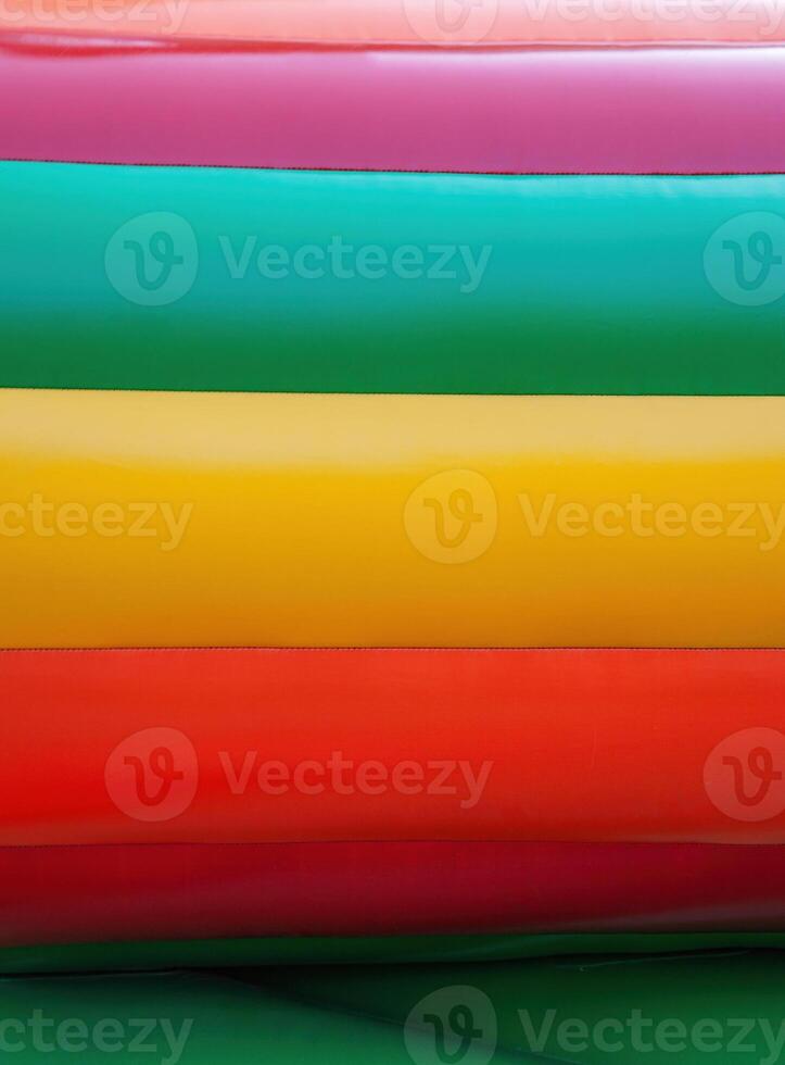 Abstract background of bright colourful plastic playground photo